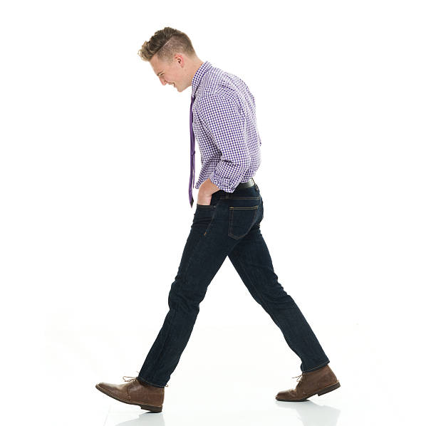 istock Smiling businessman walking 583692270