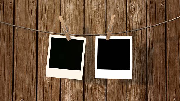 istock two blank instant photo hanging on the clothesline 583693164