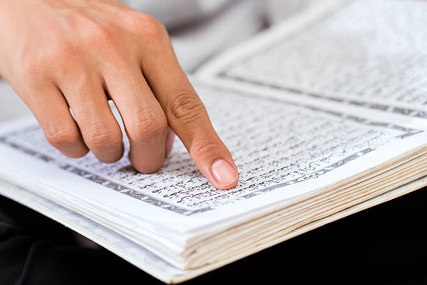 istock Asian Muslim man studying Koran or Quran 583693832