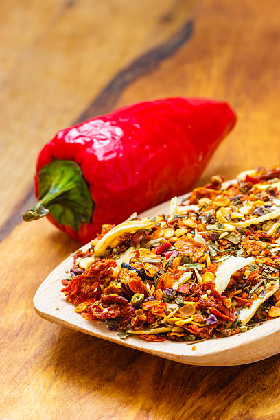 istock Colored spices for pasta mix on wooden spoon 583693890