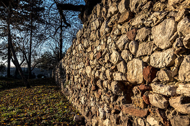 istock Stone wall in city park 583694878