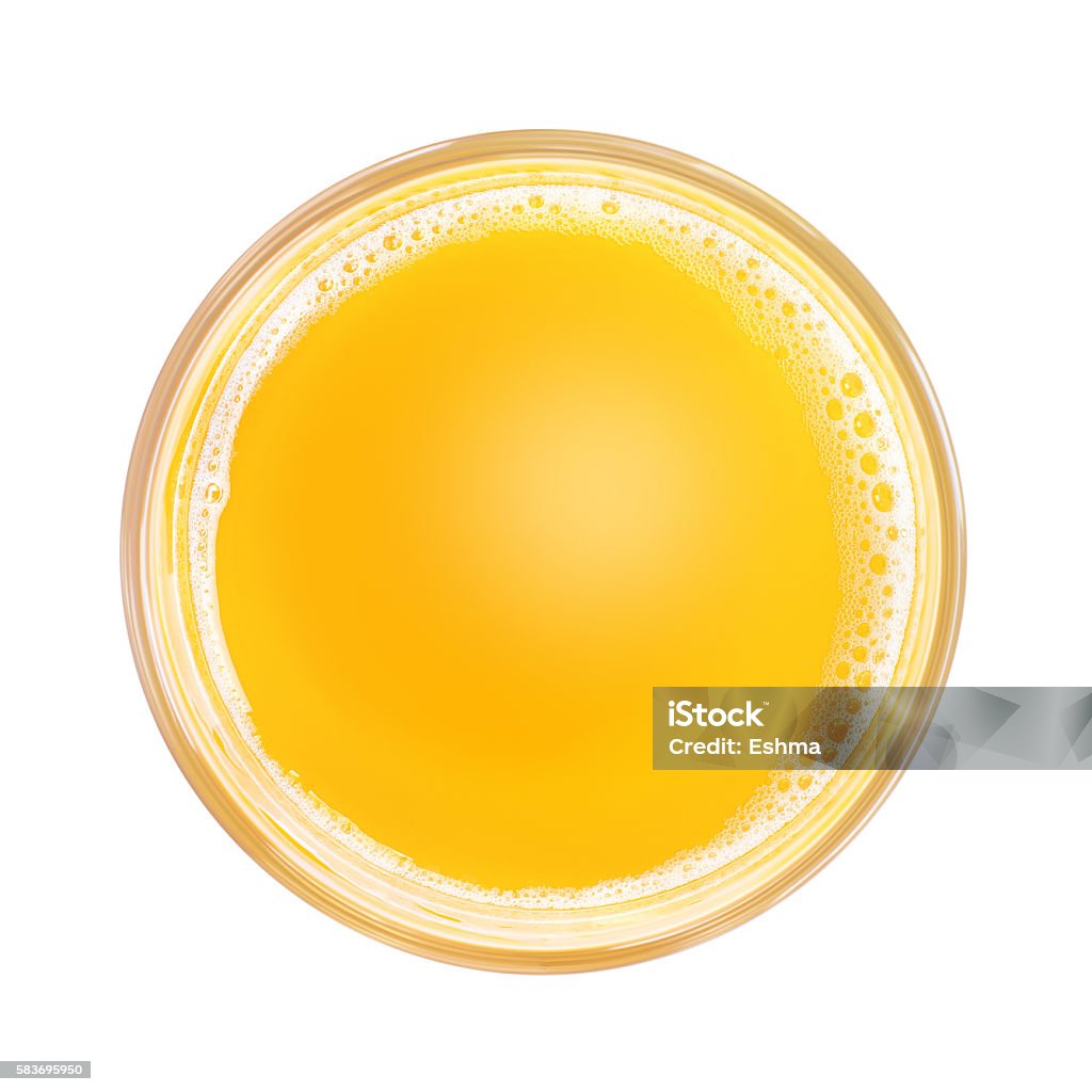 Soft drink in glass. Top view Top view of yellow soft drink and white foam in simple glass. Isolated on white background. Round copy space in center Juice - Drink Stock Photo