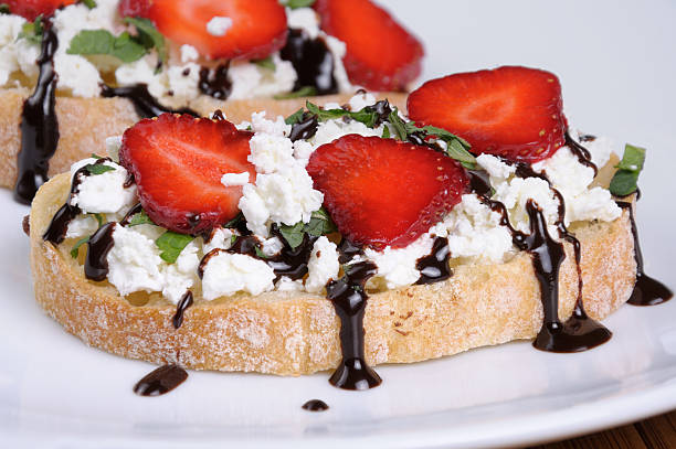 Sandwich with ricotta and strawberries Sandwich  ricotta and mint with strawberry slices and chocolate topping sandwich new hampshire stock pictures, royalty-free photos & images