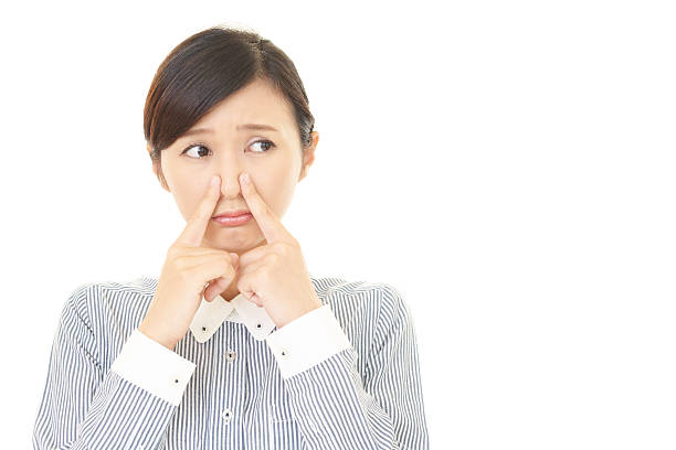 istock Woman pinches her nose 583697424