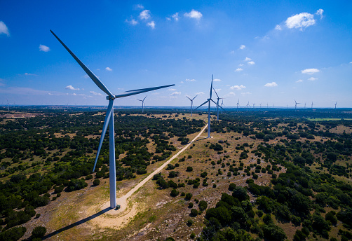 Amazing Aerial Wind Turbine Farm Goldthwaite Texas New wind Turbine Farm in central Texas. This large vast renewable energy and sustainable electricity at a cheaper cost than oil and gas fossil fuels. This clean wind farm will power thousands of homes. 