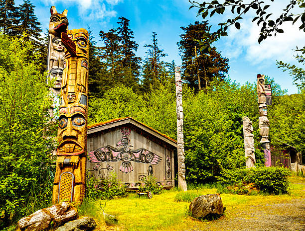 istock Native American Clan House and Totems 583699880