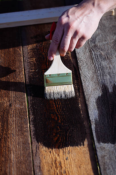 istock Paint brush on wooden table use for home decorated. 583701040