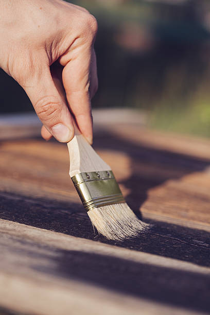 istock Paint brush on wooden table use for home decorated. 583701078