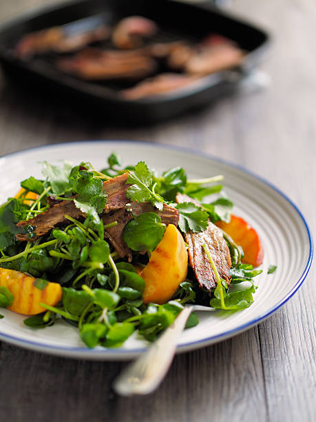 grilled duck salad Healthy freshness grilled duck breast with grilled peach and watercress watercress stock pictures, royalty-free photos & images