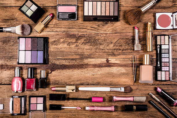 set of brushes for makeup on wooden background. fashion, beauty