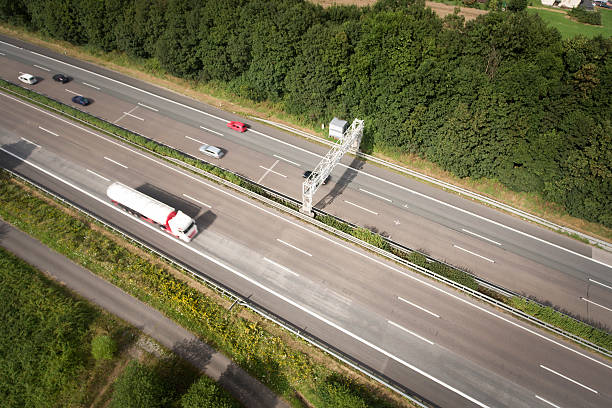istock Highway and control gantry - aerial view 583705784