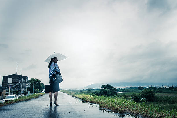 istock Woman are holding an umbrella, dark image 583708128