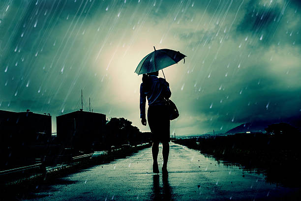istock Woman are holding an umbrella, dark image 583708226
