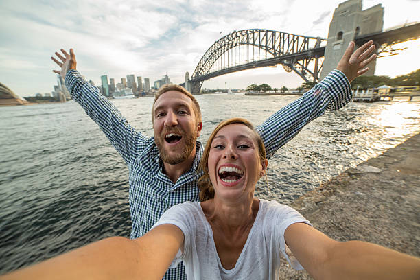 istock Two young adults take selfie at Sydney harbour 583709360