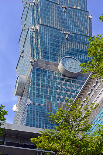 Taipei, Taiwan: July 2, 2016: Taipei 101, a financial center, mall and prestigious address for corporate tenants is also a tourist attraction built to withstand typhoon winds and earthquakes.