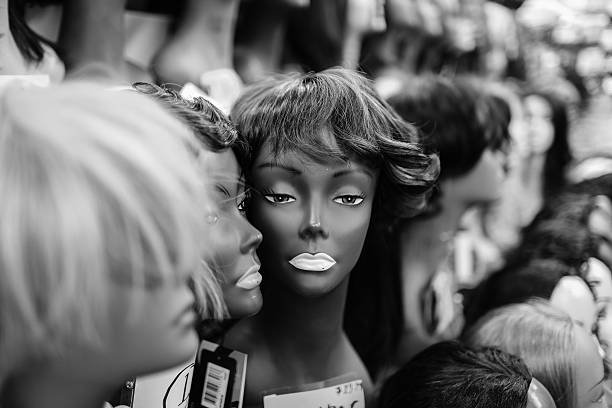 Black women mannequin heads on display.  Wigs.