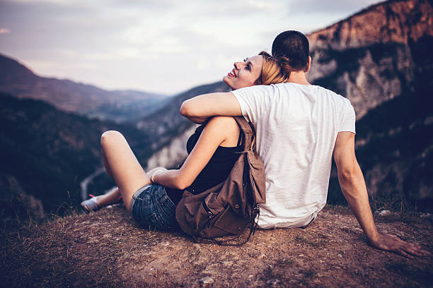 istock Couple sittingg on mountain 583711046