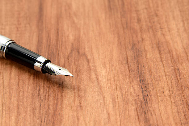 Fountain pen on wooden desk