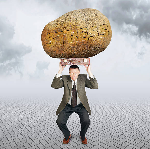 istock Businessman under the burden of stress 583711558