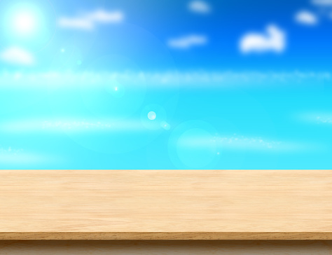 Wood table top with blurred sea,sun and beach at background, Mock up template for display or montage of your product, Summer holiday concept.