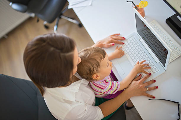 istock Mom and child in office 583714308