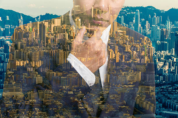 istock multi exposure of young business man in the skyscraper 583715162