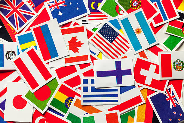 National flags of the different countries of the world National flags of the different countries of the world in a heap. Top view global banner pictures stock pictures, royalty-free photos & images