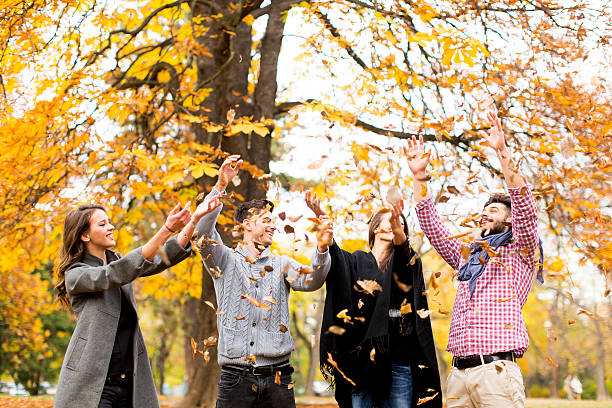 istock Young people in autumn park 583716814