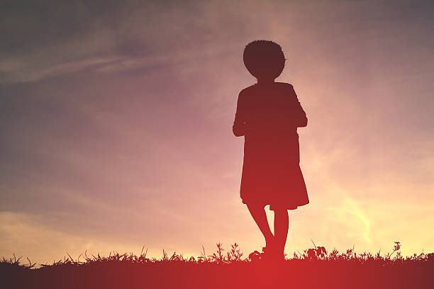 istock Silhouette a girl playing at sunset 583717650