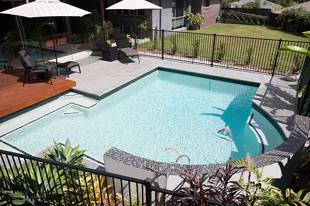 istock Closeup of a modern swimming pool with light blue water 583718482