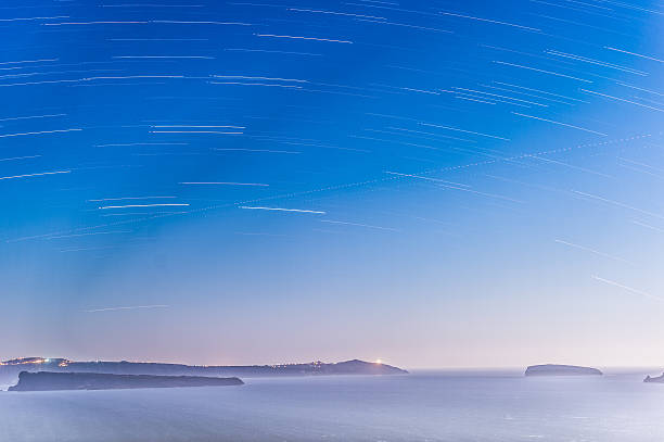 Star trails over the sea stock photo