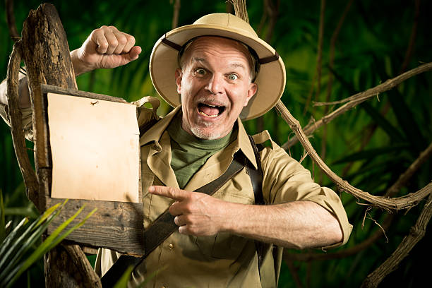 istock Cheerful explorer pointing to a sign 583724348