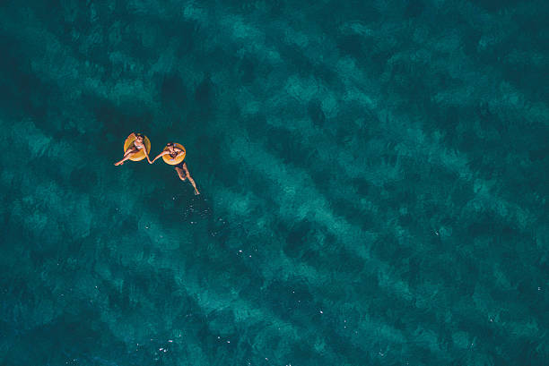 estate divertente! - sea swimming greece women foto e immagini stock