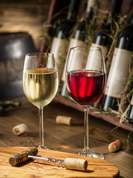 istock Wine bottles on the wooden shelf. 583724710