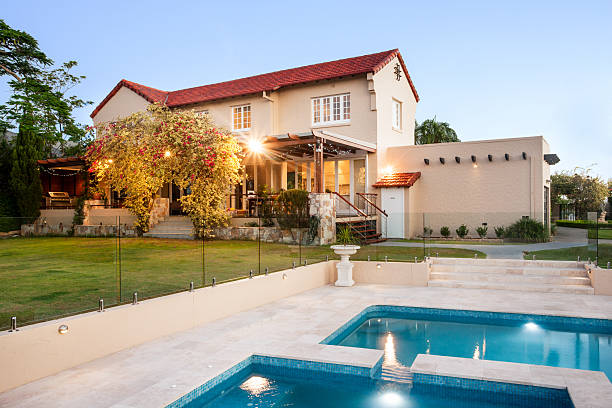 istock Modern mansion decorated with natural items like garden and pool 583725448