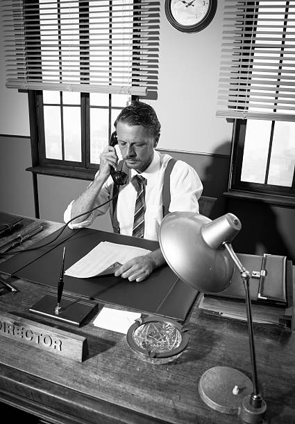 istock 1950s office: director on the phone 583725466