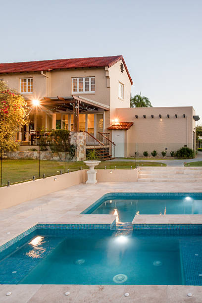 istock Modern mansion with flashing lights around the swimming pool 583725652