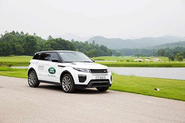 E.m. 2016 because Hanoi, Vietnam - July 13, 2016: Range Rover (Land Rover) Evoque 2016 car on the test road in golf area in Vietnam. evoque stock pictures, royalty-free photos & images