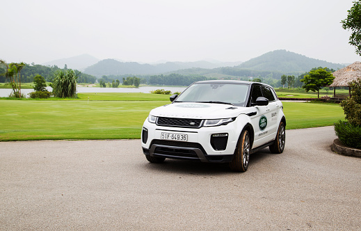 Hanoi, Vietnam - July 13, 2016: Range Rover (Land Rover) Evoque 2016 car on the test road in golf area in Vietnam.