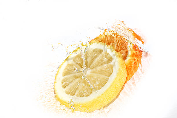 istock Water splash on lemon and orange slices 583726568