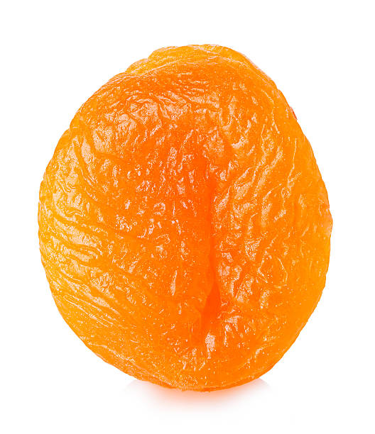 Dried apricots close-up on a white background.