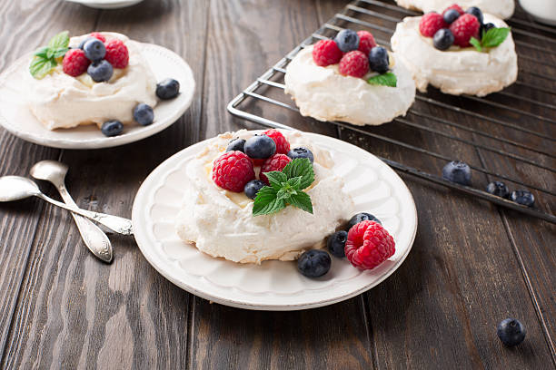istock Pavlova cake with fresh summer berries 583727932