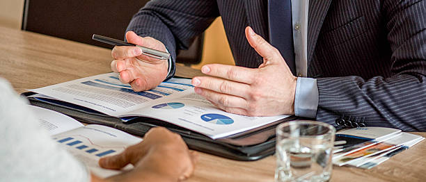 Close up of male hands on business document