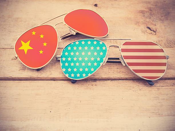 istock mirror sunglasses as American and Chinese flag pattern 583731964