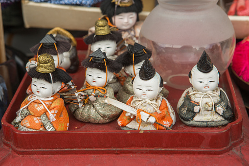 kyoto, japan - May 26, 2016: small japanese warrior decoration statues are on sale at flea market in kyoto japan