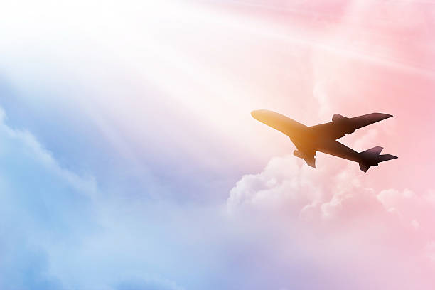 istock Airplane in the sky and cloud colorful at sunset 583733982