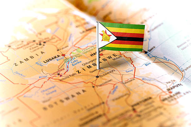 zimbabwe pinned on the map with flag - zimbabwe imagens e fotografias de stock
