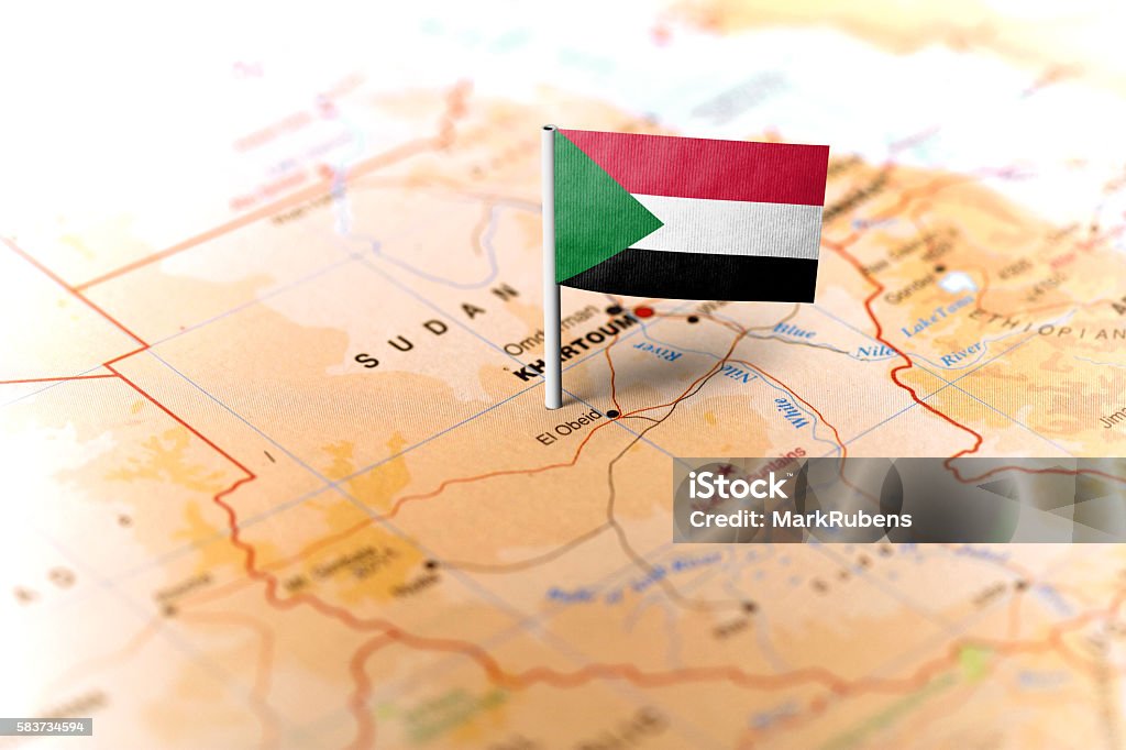 Sudan pinned on the map with flag The flag of Sudan pinned on the map. Horizontal orientation. Macro photography. Sudan Stock Photo