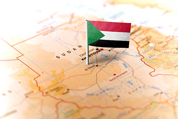 Sudan pinned on the map with flag The flag of Sudan pinned on the map. Horizontal orientation. Macro photography. sudan stock pictures, royalty-free photos & images