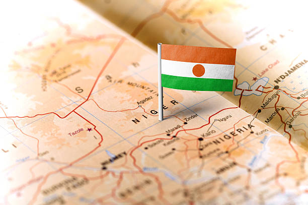 Niger pinned on the map with flag The flag of Niger pinned on the map. Horizontal orientation. Macro photography. niger stock pictures, royalty-free photos & images